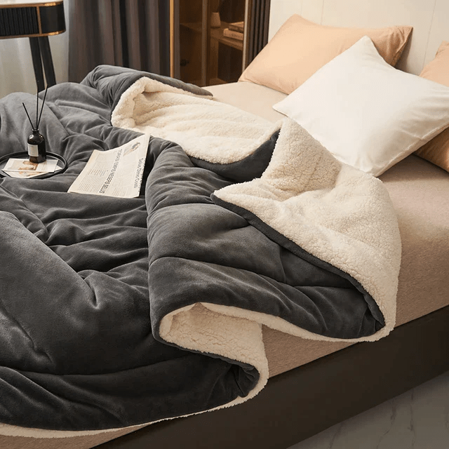 Indulge in this luxurious soft fleece blanket, perfect for adding warmth and sophisticated comfort to any room.