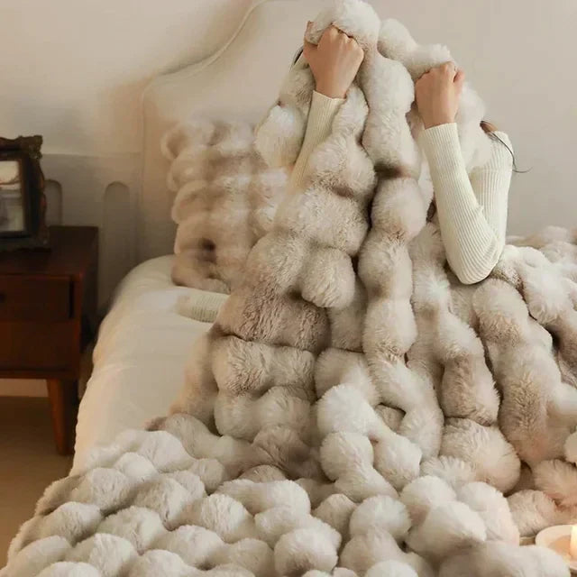 Portable unisex faux fur throw blanket, plush and warm, ideal for travel comfort.