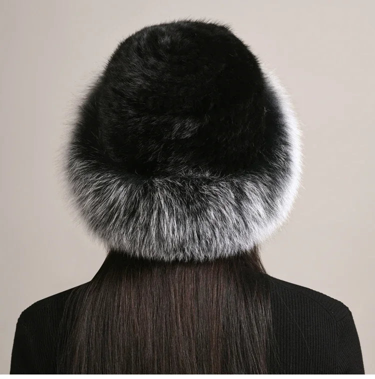 Woman models a cozy, insulated winter hat. Luxurious & warm for cold weather style. Premium fall/winter.