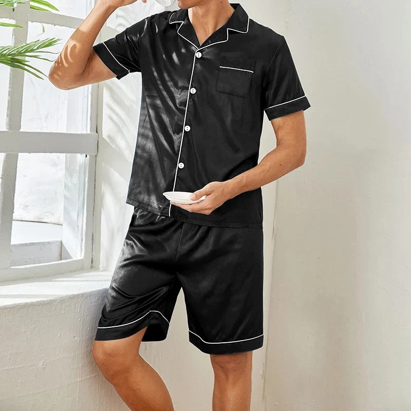 Stylish women's black satin shorts pajama set, perfect for luxurious and comfortable nightwear.