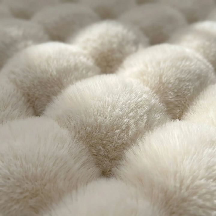 Soft & luxurious round plush area rug, adds cozy warmth to any home decor, ideal for bedrooms.