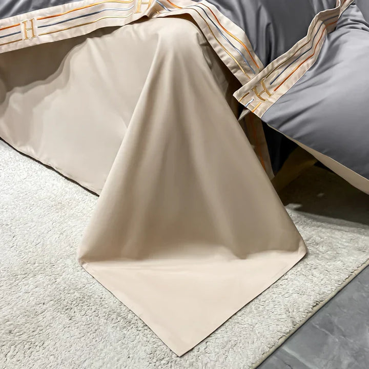 Rich hued luxurious satin 4-piece bedding set; duvet cover, fitted sheet & pillowcases for opulent decor.