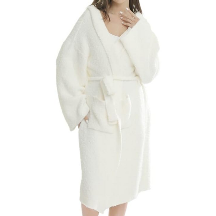 Plush hooded women's spa bathrobe. Luxurious soft loungewear for ultimate comfort.