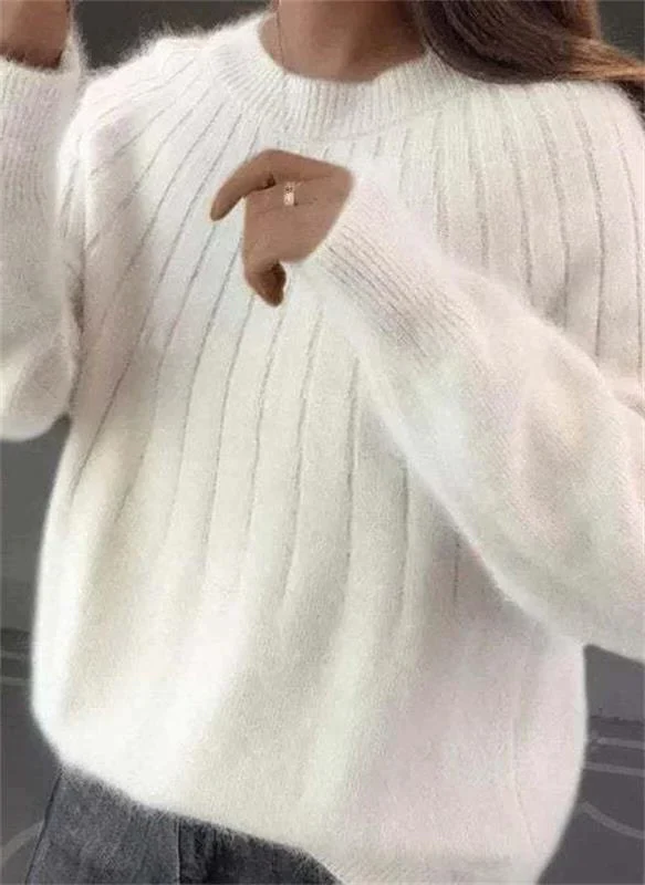 Elegant women's crew neck long sleeve knit sweater. Soft cashmere blend for luxurious and warm style.