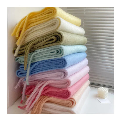 Stylish plain cashmere scarf for women, a chic accessory for cold weather.