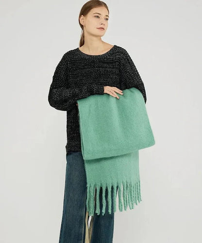 Long plain cashmere scarf for women, perfect for versatile winter fashion.