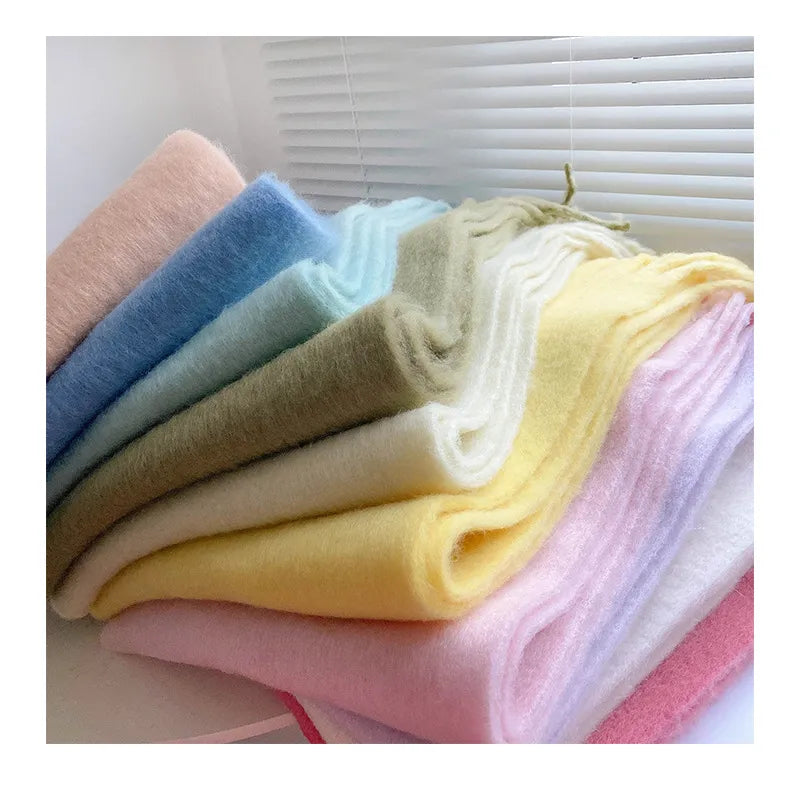 Neatly folded women's cashmere scarf, ready for elegant winter warmth.