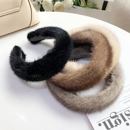 Luxurious women's faux fur headband, perfect for warm winter style and elegant fashion.