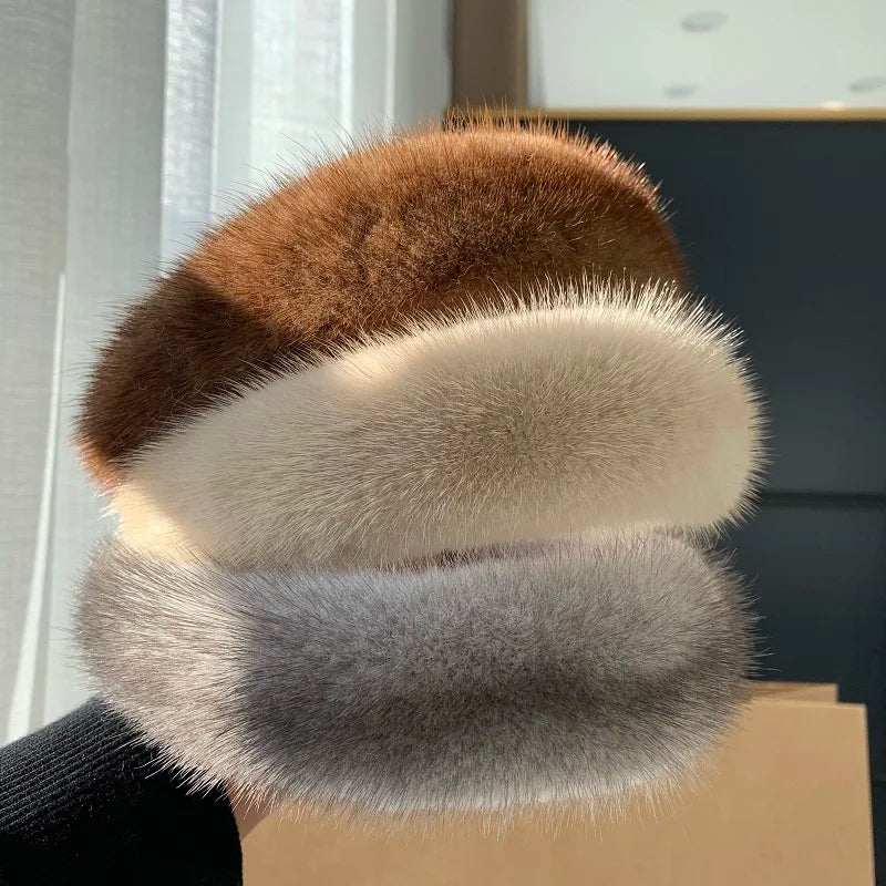 Cozy women's faux fur headband, an essential winter accessory for warmth and comfort.