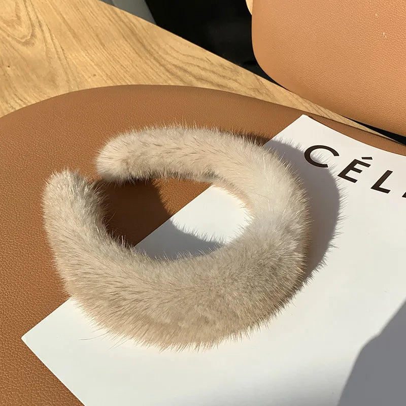 Fashionable women's faux fur winter headband, a cozy and stylish accessory for any look.