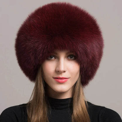 Elegant women's genuine fox fur hat, providing luxurious warmth and style for winter. Adjustable fit.