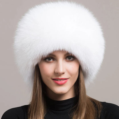 Fashionable women's fur hat made with soft, genuine fox fur. A luxurious and warm accessory for winter.