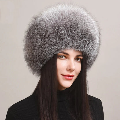 Plush women's fox fur winter hat, offering luxurious warmth and elegant style for cold weather. Genuine and cozy.