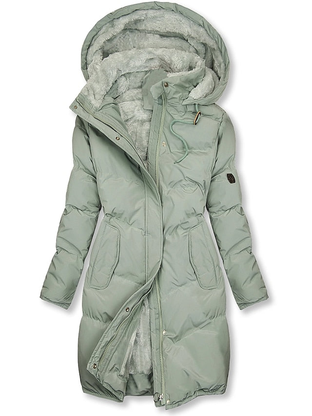 Cozy women's insulated winter jacket with a warm hood, designed for comfort and protection against the cold.