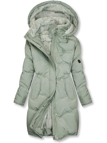 Cozy women's insulated winter jacket with a warm hood, designed for comfort and protection against the cold.