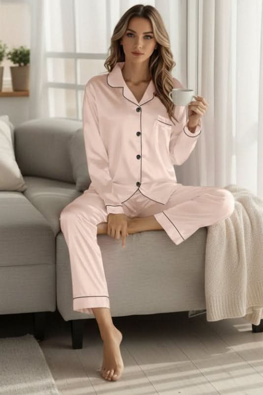 Neatly folded women's two-piece pajama set, a luxurious & comfortable gift idea for stylish sleepwear.