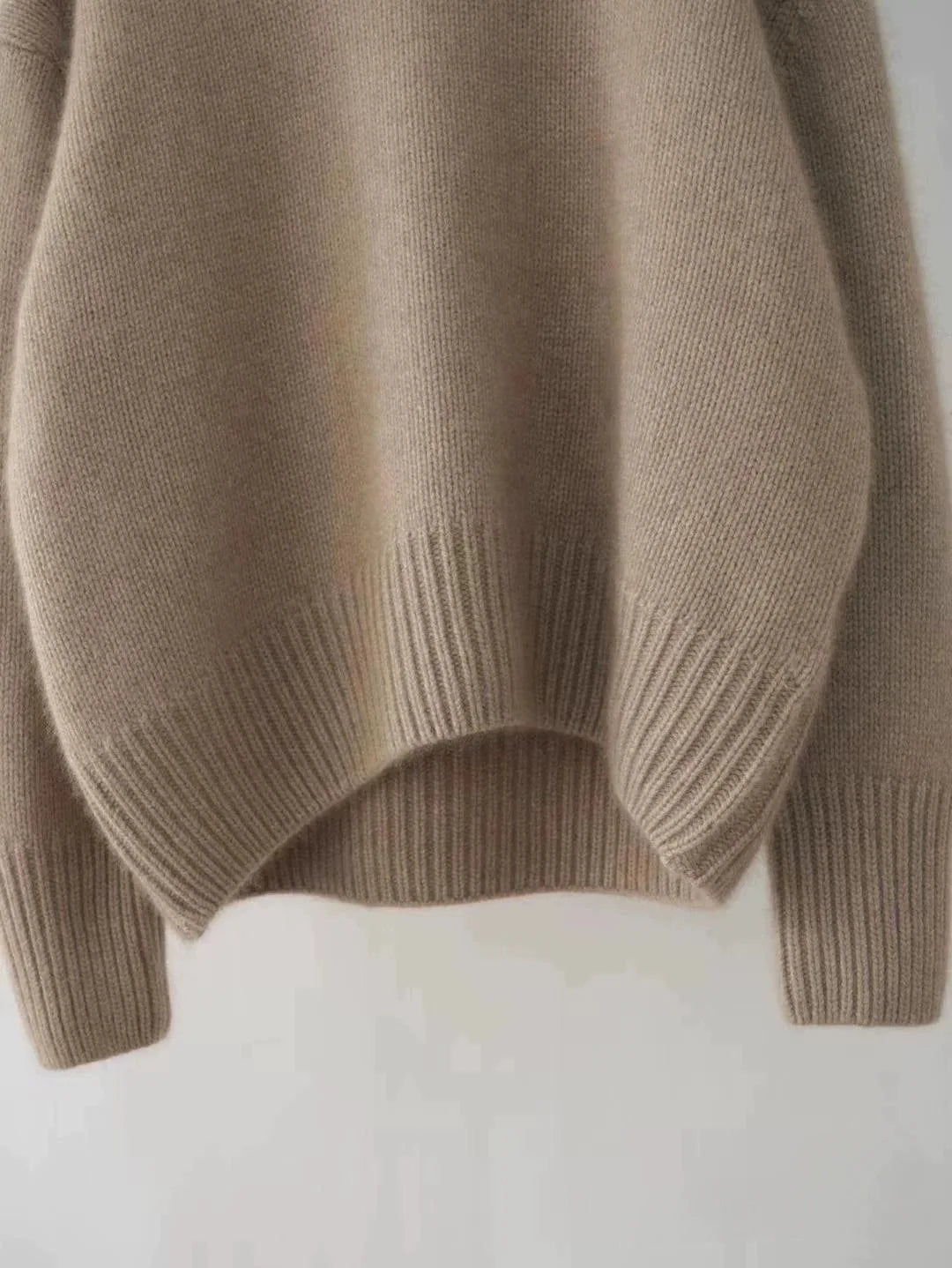 Luxurious, cozy women's oversized turtleneck sweater. Comfortable, warm, and stylish for relaxed winter wear.