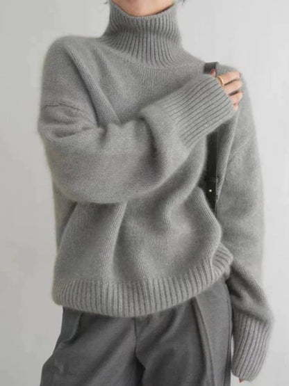 Soft, comfortable women's relaxed fit turtleneck sweater. Elegant, warm, and cozy for stylish winter outfits.