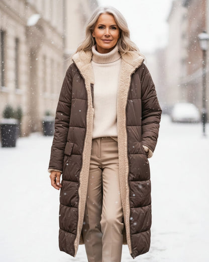 Luxurious women's warm winter coat, elegant long jacket for cold weather.