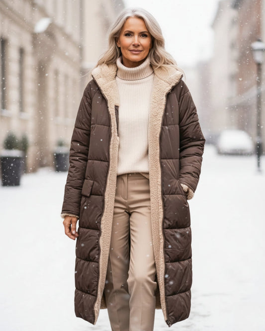 Luxurious women's warm winter coat, elegant long jacket for cold weather.