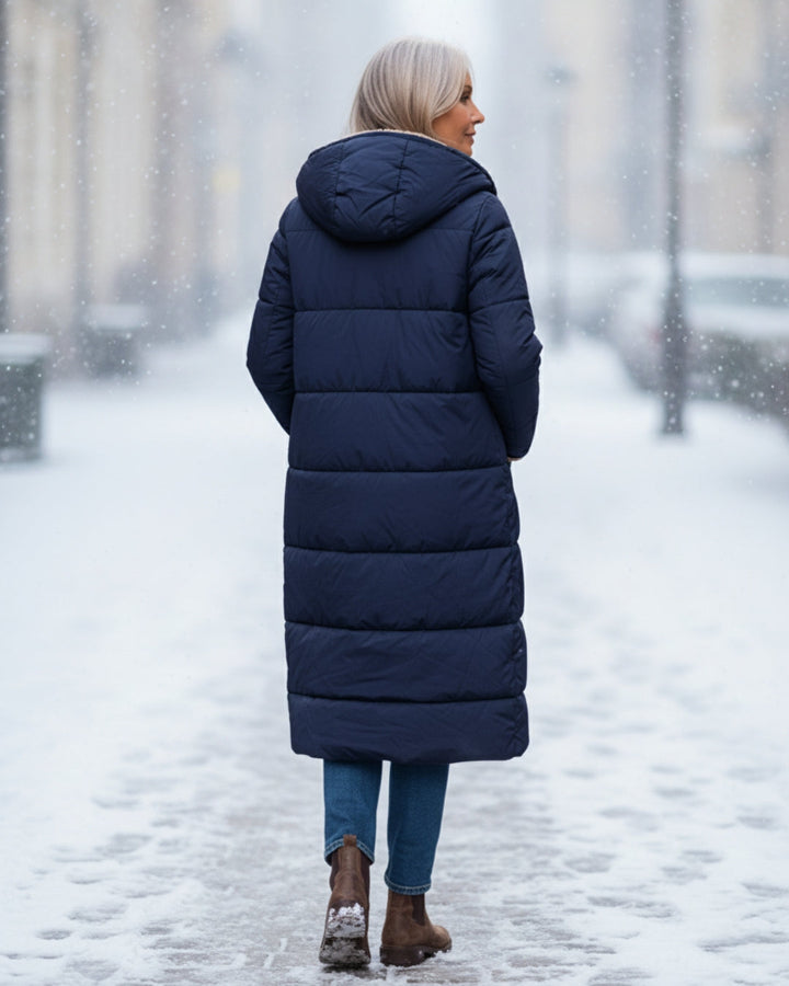 Elegant long women's winter coat, plush and warm for luxurious cold style.