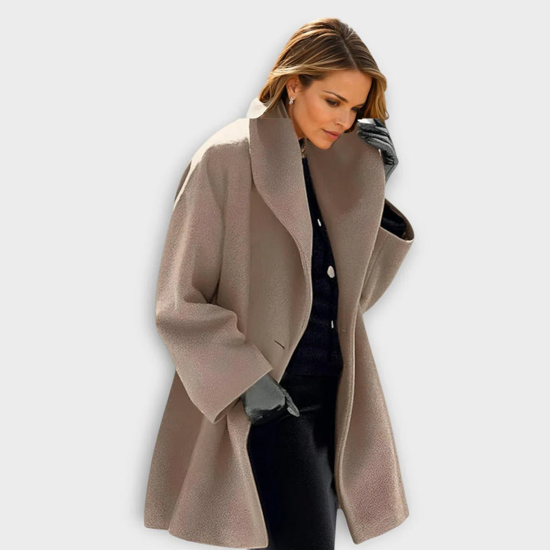 Woman wearing a luxurious windproof wool coat, ideal for stylish winter outerwear & warmth.
