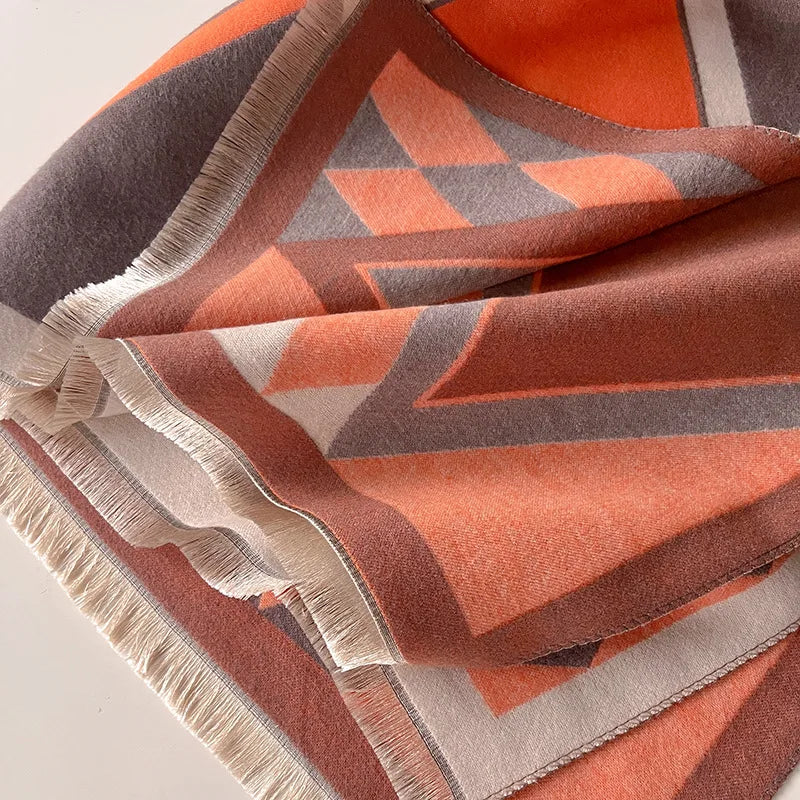 Cozy cashmere shawl wrapped around a woman's neck, providing warmth and a chic winter accessory.