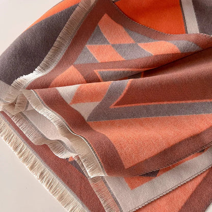 Cozy cashmere shawl wrapped around a woman's neck, providing warmth and a chic winter accessory.