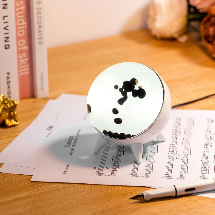Interactive art ferrofluid display, creating stunning music-reactive visuals for modern desk decor.