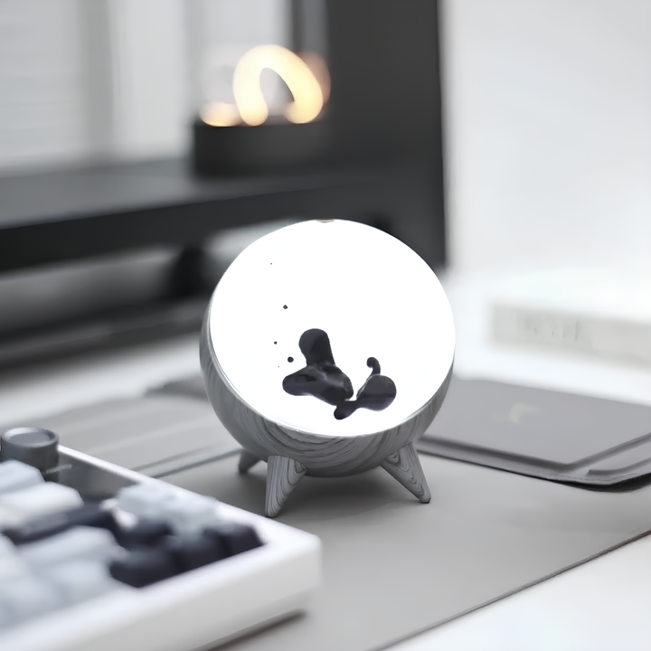 Modern desk decor featuring MagnePulse, an interactive ferrofluid display that dances to your music.