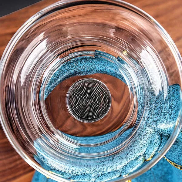 Elegant glass tea brewing set with magnetic infuser. Unisex design for sophisticated loose leaf tea rituals.