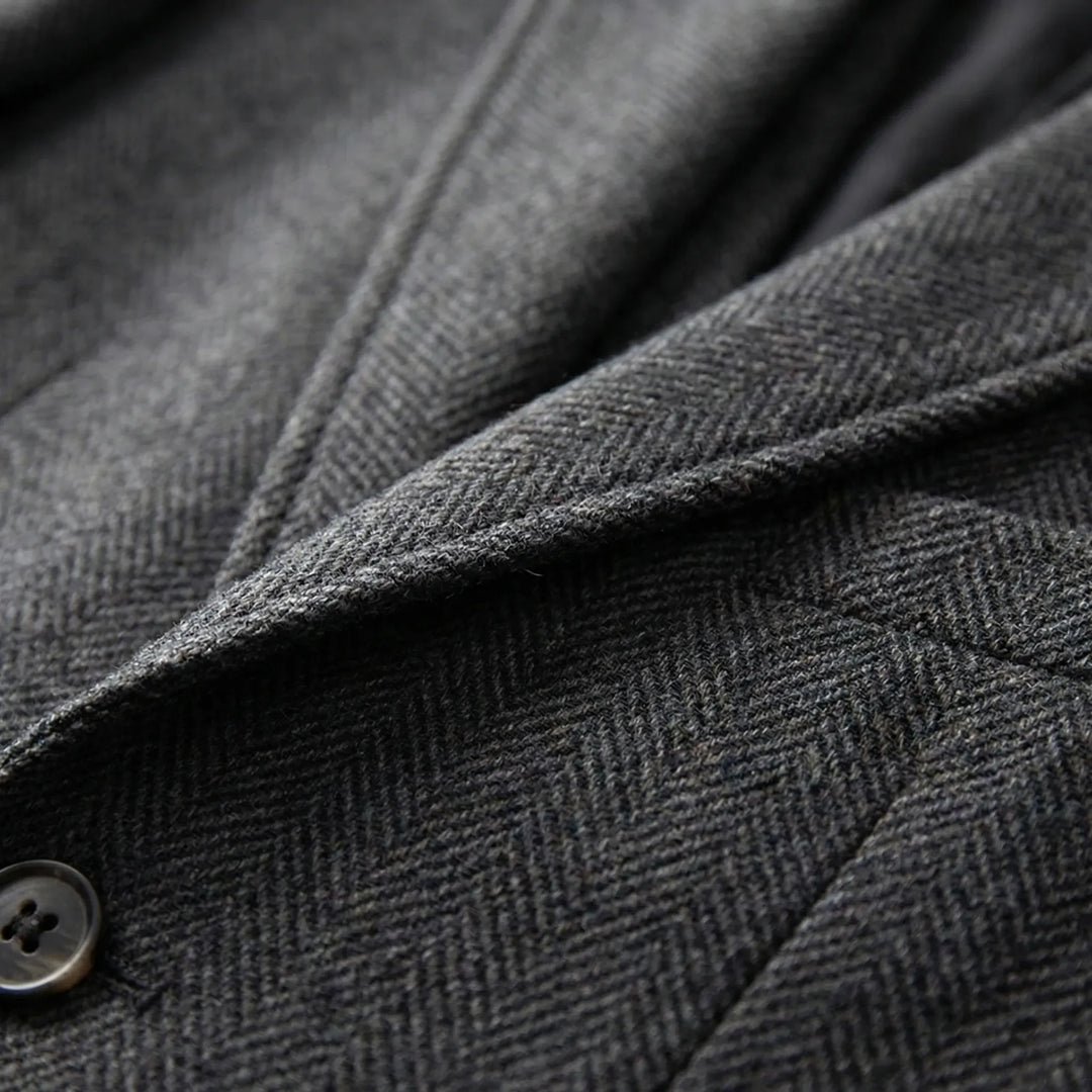 Classic men's 3-piece suit with a distinct herringbone pattern. Elegant for any formal occasion.