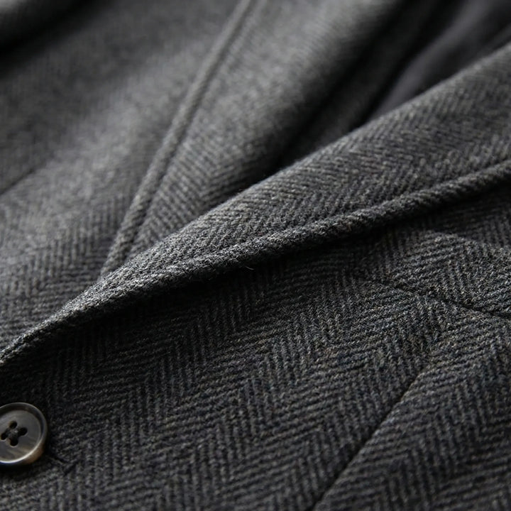Classic men's 3-piece suit with a distinct herringbone pattern. Elegant for any formal occasion.