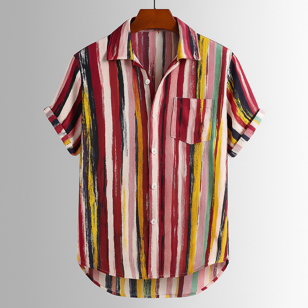 Close-up of a men's abstract artisan print shirt, showing vibrant colors and relaxed short sleeves.