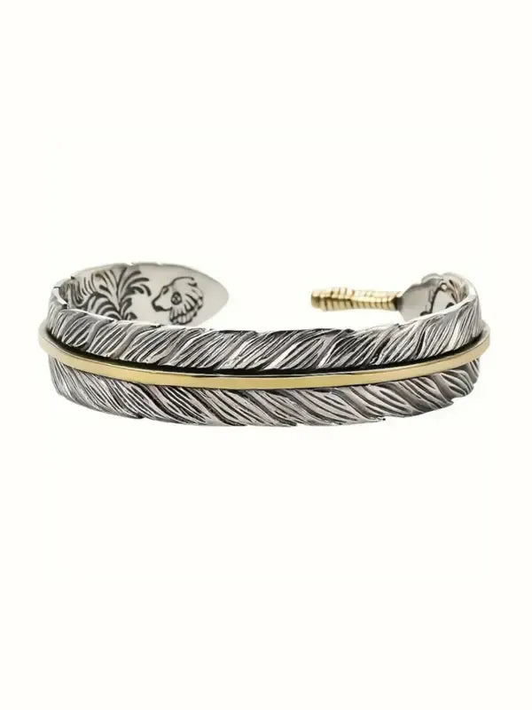 Men's adjustable stainless steel cuff bracelet with detailed feather design, perfect for a boho or metallic fashion look.