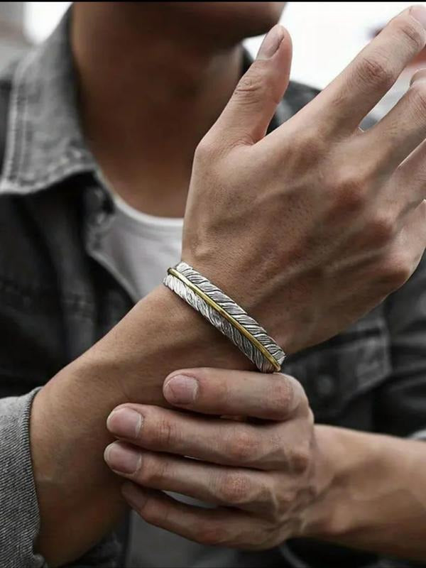 Rear view of men's stainless steel feather cuff bracelet, highlighting its sturdy build and easily adjustable open-cuff design.