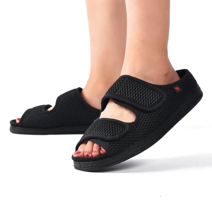 Men's adjustable wide fit slip-on shoes with breathable mesh upper & hook-and-loop closure for comfort.