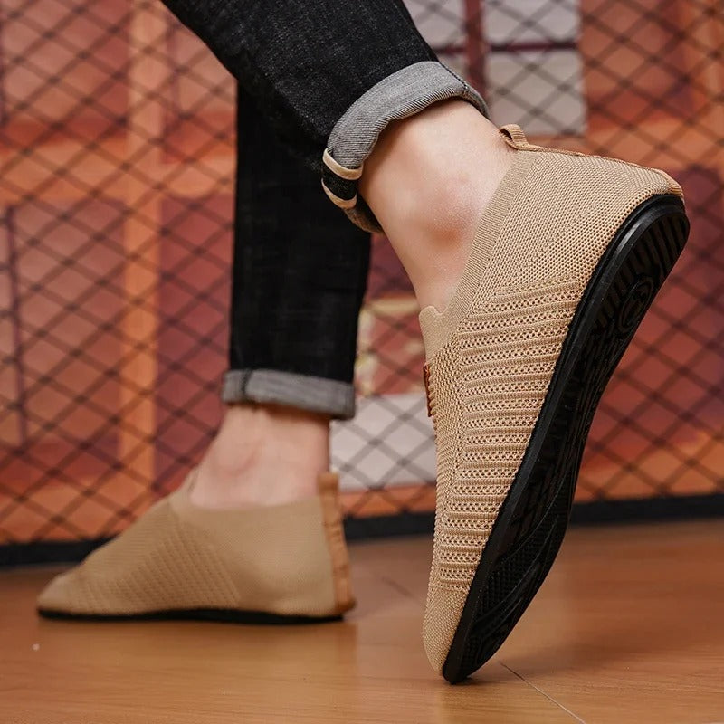 Stylish men's AirKnit breathable slip-on shoes. Lightweight comfort sneakers, great for daily wear.