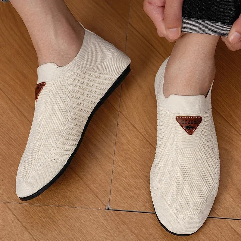 Experience comfort with men's AirKnit breathable slip-on shoes. Lightweight casual walking sneakers.