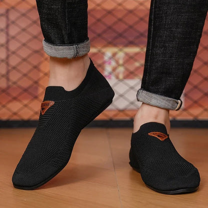 Casual men's AirKnit slip-on sneakers. Breathable, lightweight comfort shoes for easy walking.