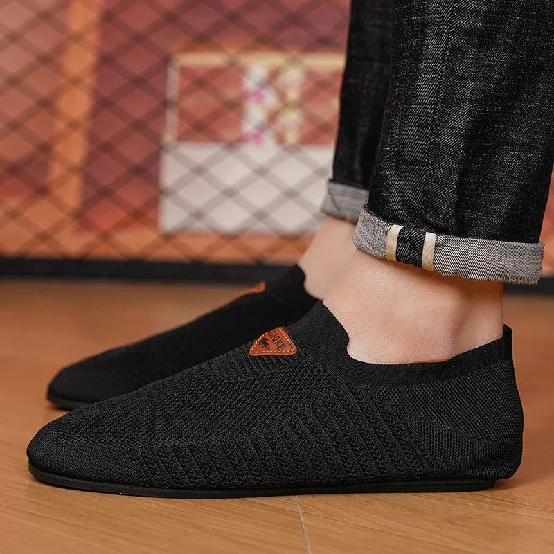 Men's walking slip-on shoes with AirKnit breathable comfort. Lightweight and easy to wear sneakers.