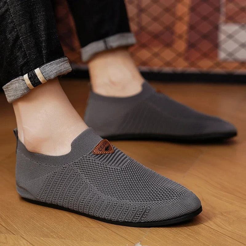 Front view of men's AirKnit breathable slip-on comfort shoes. Lightweight casual sneakers.