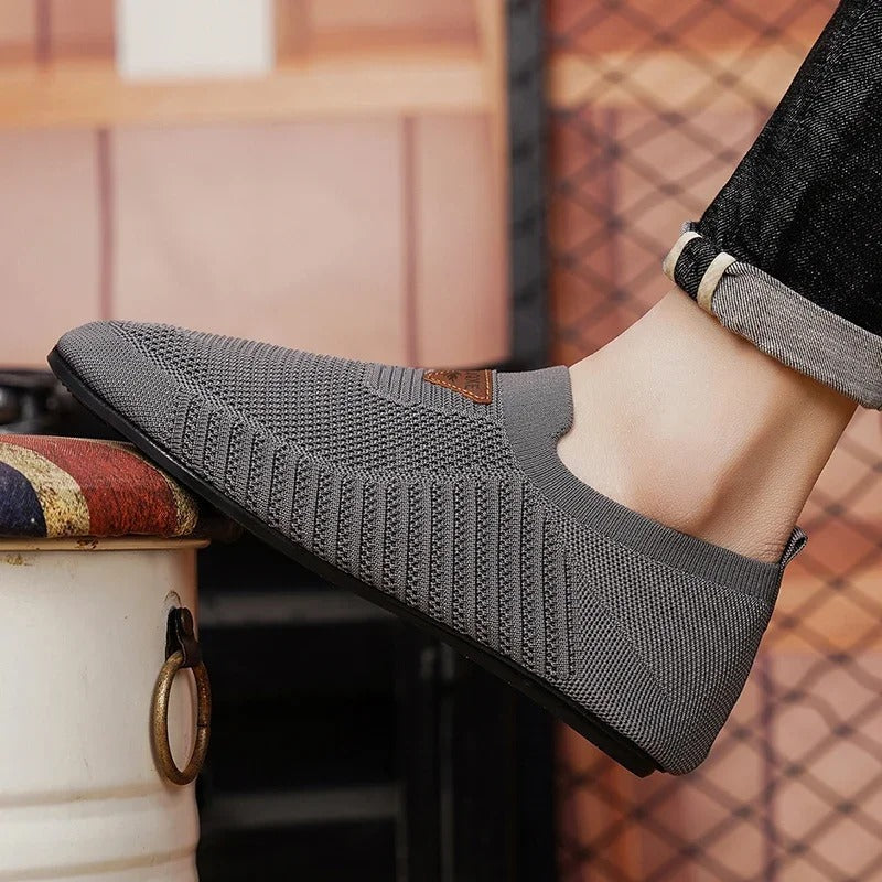 AirKnit breathable fabric men's slip-on comfort shoes. Lightweight casual sneakers for easy walking.