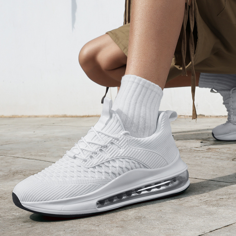 Front shot of white Airvault Max men's gym sneakers, offering premium performance.