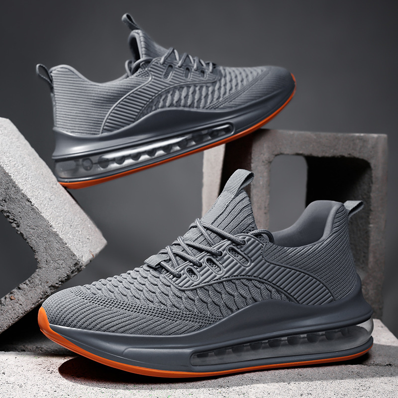 A pair of Airvault Max men's running sneakers in black and white, highlighting athletic design.
