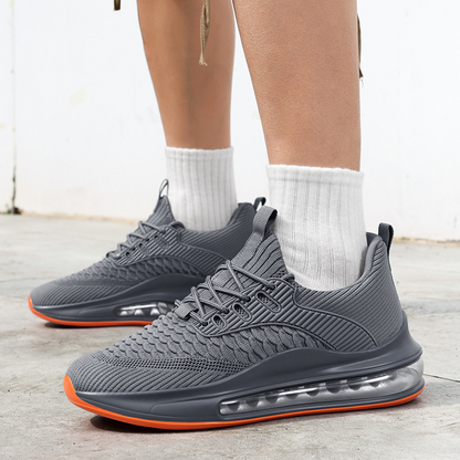 Man walking in Airvault Max black running shoes, showcasing activewear style.
