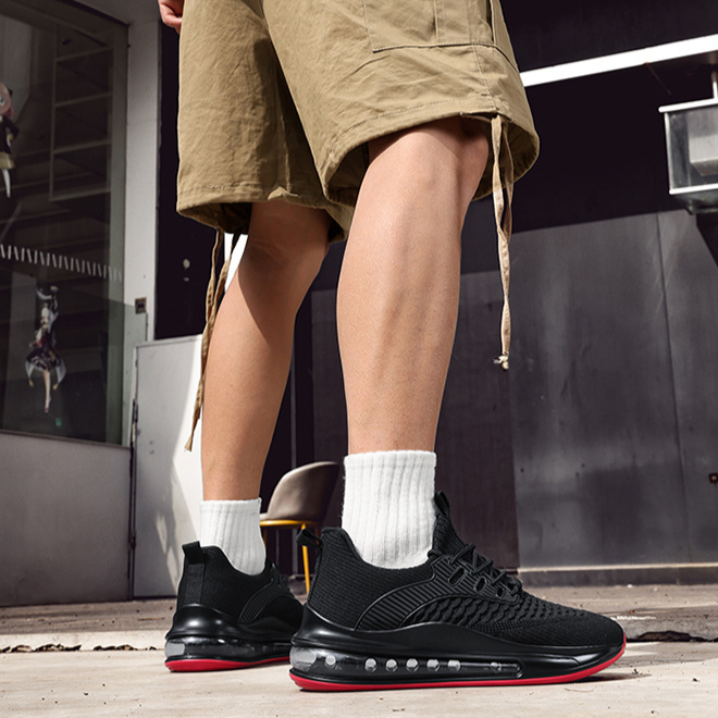Close-up of mesh upper on Men's Airvault Max black performance running sneakers.