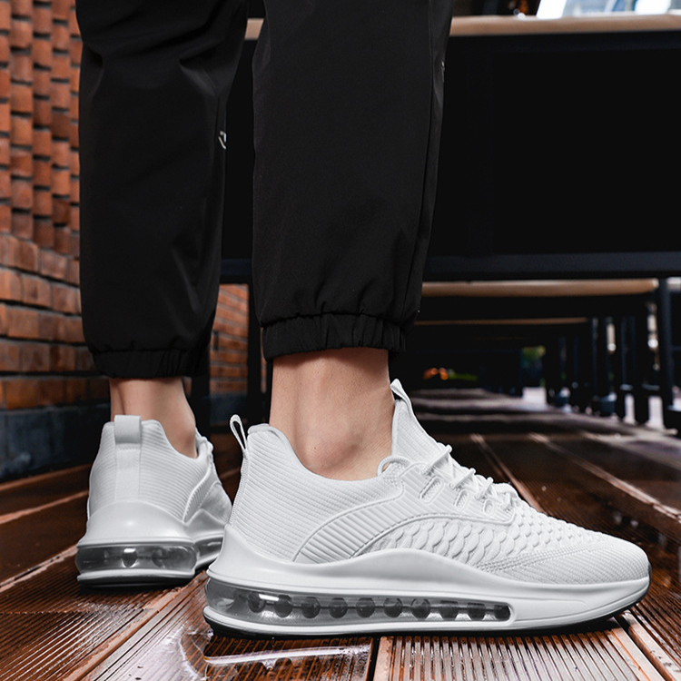 Side view of white Airvault Max men's athletic footwear, ideal for running & workouts.