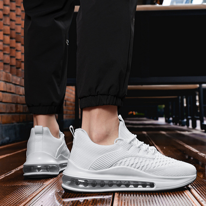 Side view of white Airvault Max men's athletic footwear, ideal for running & workouts.