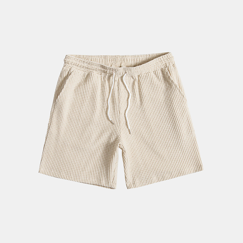 Man relaxing in a comfortable men's Algarve waffle loungewear set, perfect for casual home wear.